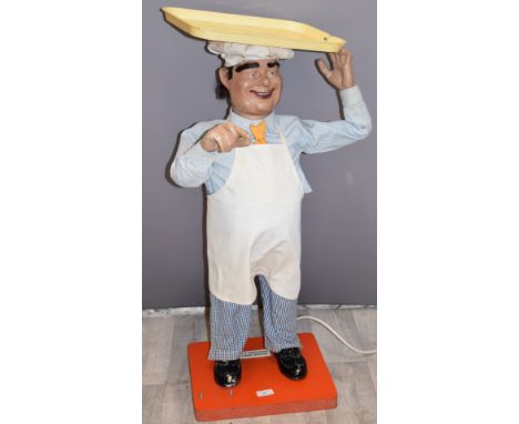 Novelty vintage shop window display advertising automaton model of a baker with tray on his head, with plaque to base for J H