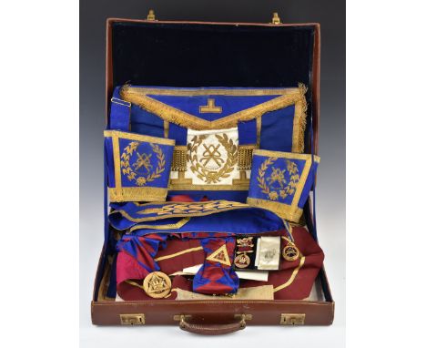 Masonic jewels and aprons in leather carry case, including enamel decorated example, in original box
