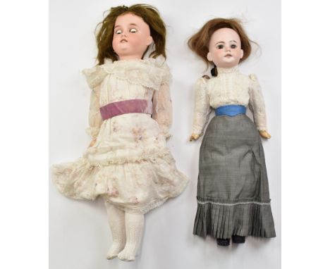 Two bisque headed dolls comprising one Gebruder Kuhnlenz with weighted brown eyes, open mouth, brown hair and articulated com