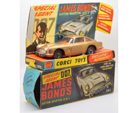 Corgi diecast model James Bond 007 Aston Martin D.B.5 with gold body, red interior, spoked hubs and figure, 261, in original 