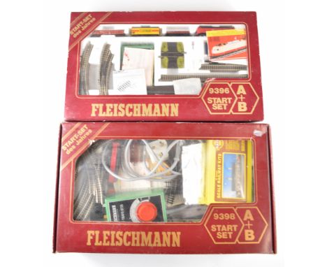 Two Fleischmann N gauge model railway 9396 sets, each including DB diesel locomotive and goods wagons, together with extras