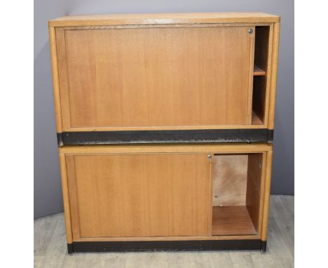 Two Gordon Russell of Broadway light oak tambour fronted cupboards, W120 x  D50 x H70cm