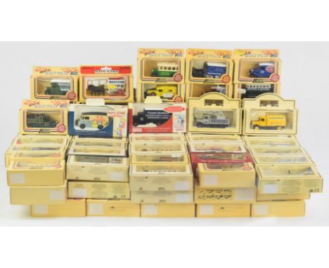 One hundred Lledo Models of Days Gone diecast model vehicles to include Hamleys London Transport Bus, United States Military 