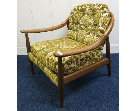 A mid 20th century teak framed Greaves &amp; Thomas stick back armchair, 72cm high x 70cm wide x 76cm deep Condition Report:A