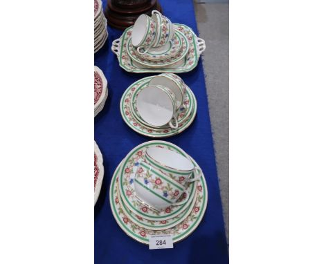 A Royal Worcester teaset decorated with intertwining roses and blue flowers Condition Report:Available upon request