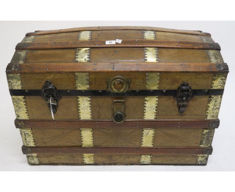 A Victorian wood and brass bound dome top steamer trunk, 60cm high x 83cm wide x 49cm deep Condition Report:Available upon re