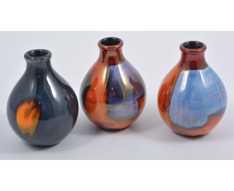 Three Poole pottery vases, abstract design, 13cms, (3).