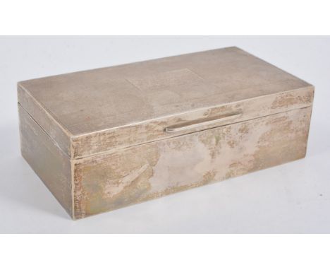 A silver cigarette/jewel box, engine turned cover with vacant initial plate, plain polished sides, no personal inscriptions o