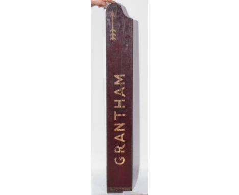 Wooden railway sign, 'Grantham', painted in cream on burgundy ground, right facing arrow (possibly from Peterborough (North) 