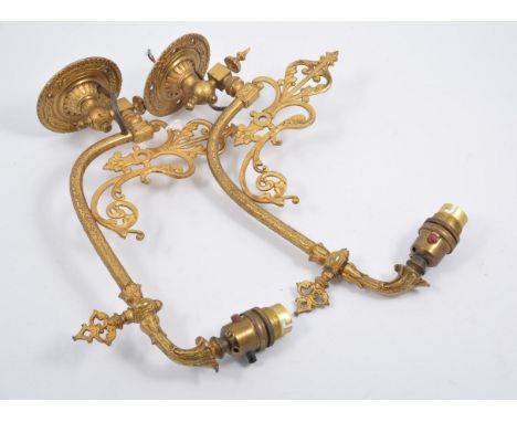 Pair of Victorian gilt metal oil lamp brackets, adapted for electricity, depth 32cm.