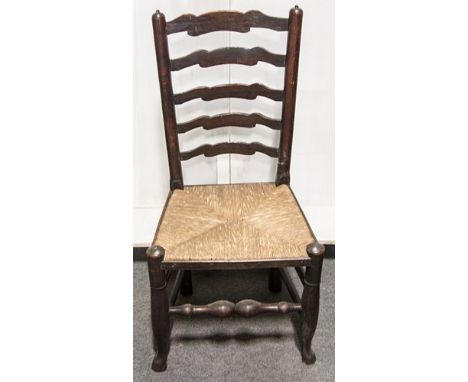 One Lancashire type stained ash ladder-back chair, rush seat, turned legs joined by rails, width 50cm; and two very similar c