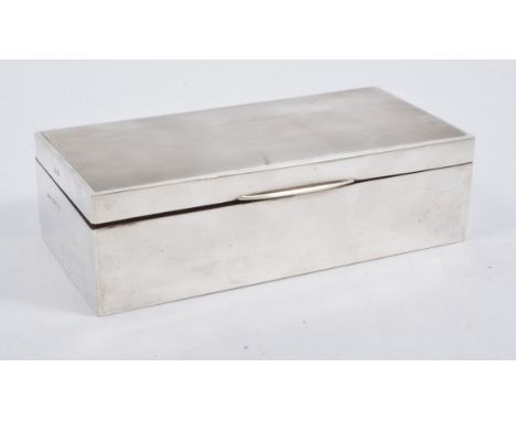 A silver cigarette/jewel box, rectangular engine turned cover with plain sides, twin compartment cedar lined interior, 18cm x