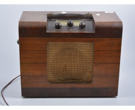 Two walnut cased Pye radios, and a walnut cased speaker.
