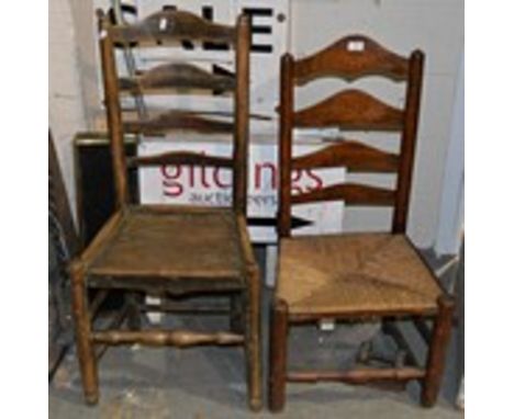 Two ash ladder-back dining chairs, with rush seats.
