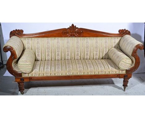 Victorian mahogany framed sofa, shaped back with carved pediment, scrolled and carved arms, turned and ringed legs, length 27