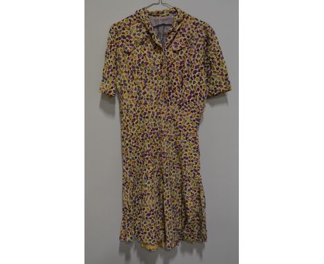 A vintage cotton tea dress, cream printed with fruit, buttoned bodice with two patch pockets, an Alice Edwards "Italianettas"