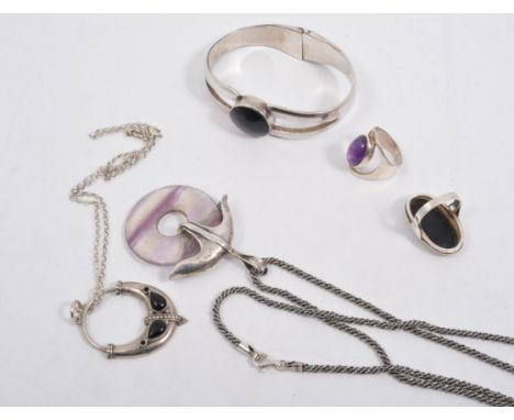 A collection of jewellery stamped 925, a Mexican bangle set with black onyx, a similar ring and pendant and chain, a mauve an