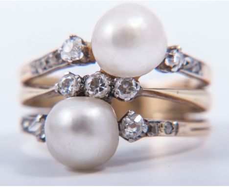 A three row diamond and pearl ring, the centre ring claw set with three diamonds with the outer two bands each set with a 7.5