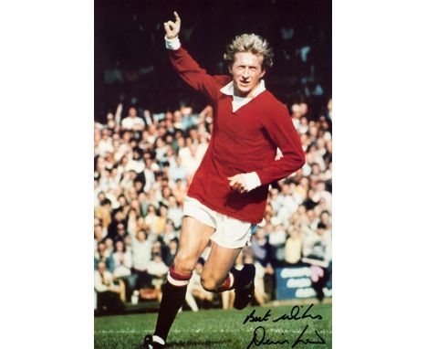 A large signed colour photographic print of Denis Law,
wheeling away in goal celebration for Manchester United, signed in bla