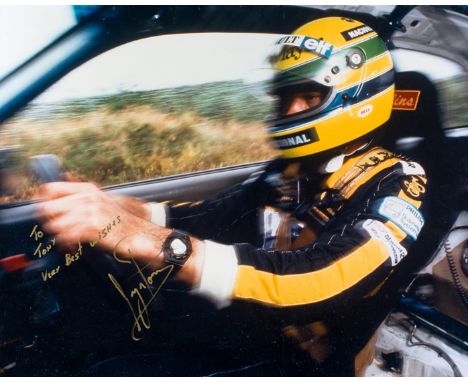 Ayrton Senna signed large colour photo,
his signature and dedication 'To Tony' in gold ink upon his image, unusually driving 