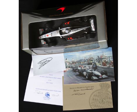 David Coulthard signed cards with a 1:18 scale model of his F1 McLaren Mercedes, 
the model featuring his saltire helmet desi