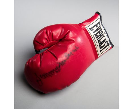 A glove signed by the Irish-Canadian boxing legend Jimmy McLarnin,
a red Everlast left-hand glove signed in black marker pen
