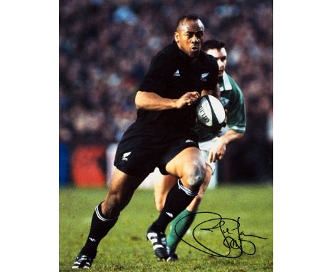 A Jonah Lomu signed photograph,
20 by 16in. colour, depicting Lomu in match-action for New Zealand v Ireland, framed & glazed