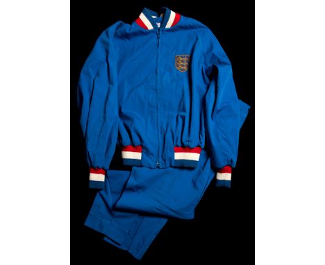 Roger Hunt's 1966 World Cup England tracksuit,
by Mitre, the top and bottoms inscribed in ink R H, the blue zip-up tracksuit 