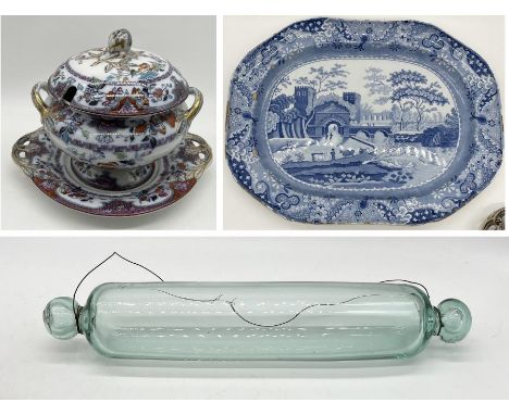 A Victorian glass rolling pin along with a large antique blue and white meat platter and a Victorian lidded tureen