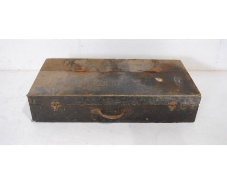 A rustic wooden tool trunk with various tools etc.