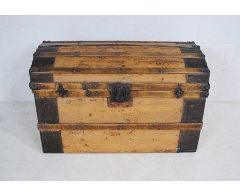 A metal bound domed top trunk, marked 'MVC' - length 92cm, depth 52cm, height 59cm