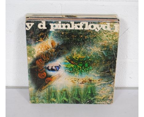 A collection of fourteen rock 12" vinyl records, comprising Pink Floyd, David Bowie, The Rolling Stones, Led Zeppelin, Jethro