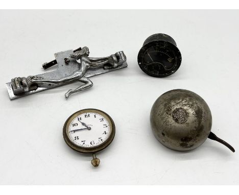 A collection of items including chrome car mascot, Lucas King of the Road bell, Swiss made car clock etc.