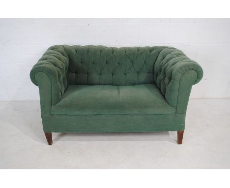 A green Chesterfield sofa with button-back detailing - length 141cm