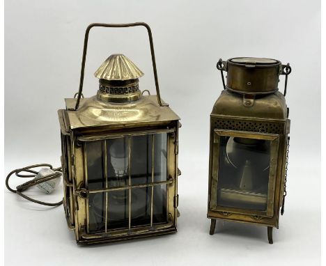 Two brass ships lanterns one larger example with grill surround and the other a storm lamp