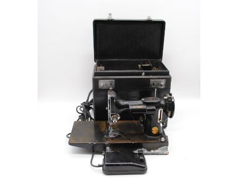 A vintage boxed Singer 221k 'Featherweight' portable electric sewing machine 