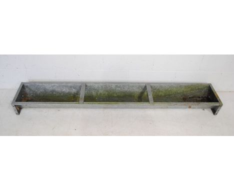 A weathered galvanised animal feeding trough - length 181cm, depth 29cm, height 14cm