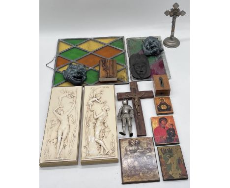 Two porcelain Nymph plaques, an assortment of religious themed items, two pieces of stained glass and four vintage children's