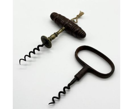 An antique Henshall type wooden handled corkscrew with brass shank along with one other 