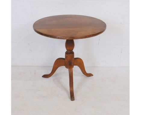 A circular pine tilt-top tripod table - diameter 61cm, depth 57cm