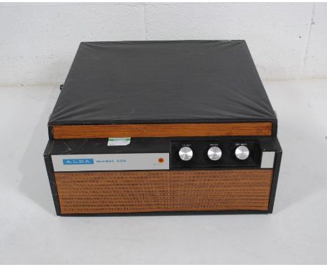 A vintage Alba model 536 portable record player with instruction manual