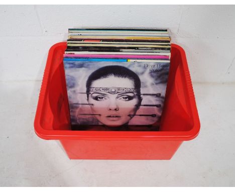 A collection of mostly 80's 12" vinyl records, including Debbie Harry, The Cars, Kim Wilde, Natalie Cole, Spandau Ballet, Tan