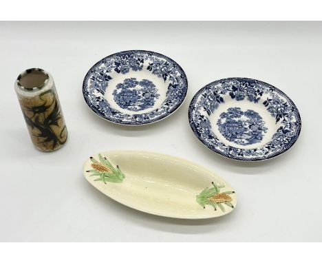 Two Clarice Cliff "Tonquin" plates for Royal Staffordshire along with a Clarice Cliff dish with corn motif and a Celtic Potte