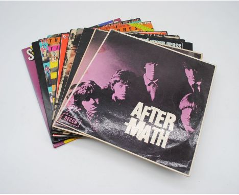 A collection of ten 12" vinyl records by The Rolling Stones, including 'After-math' (x2), 'Out Of Our Heads', 'Big Hits (High
