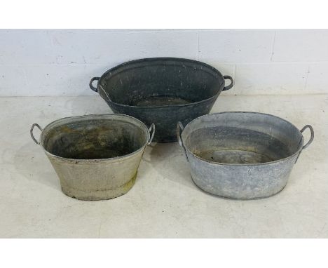 Three vintage galvanised baths 