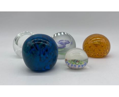 Five paperweights including Caithness and Mdina.