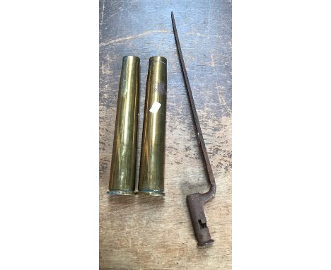 Two British 44mm AA gun shell casings one dated 1942 the other 1951with a socket bayonet marked ‘R 6’ approx 21” long.
