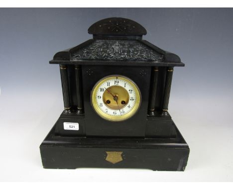 A Victorian black slate mantel clock in architectural case with presentation plaque