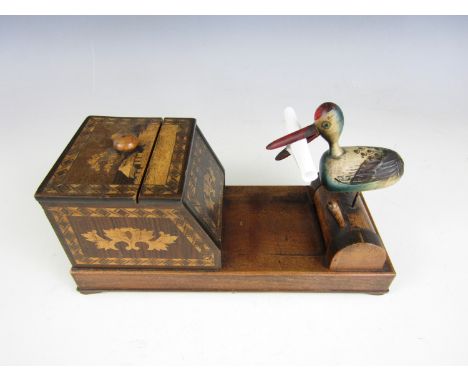 A carved and parquetry-veneered novelty automaton cigarette box
