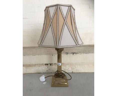 A brass columnar table lamp, 62 cm